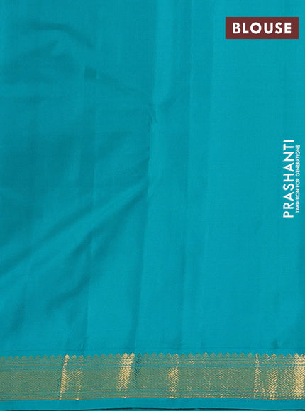Pure kanchipuram silk saree dual shade of pinkish orange and teal blue with zari woven buttas and zari woven korvai border