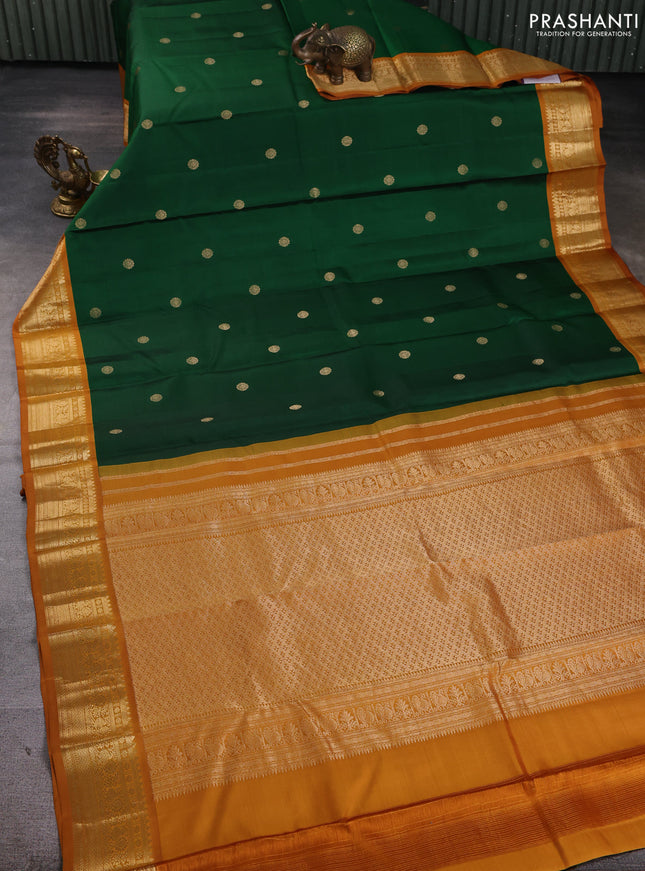 Pure kanchipuram silk saree green and dark mustard with zari woven buttas and zari woven korvai border