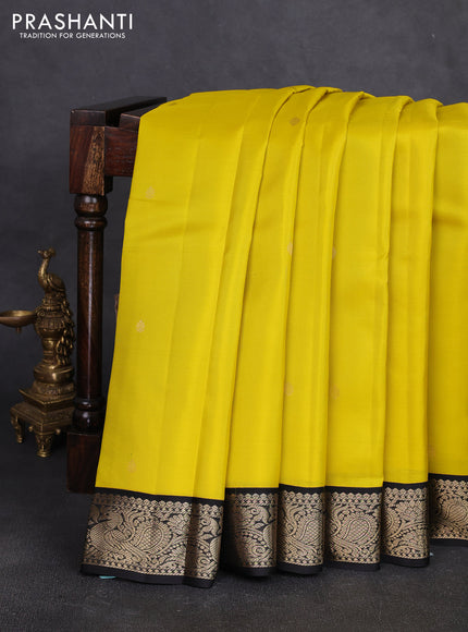 Pure kanchipuram silk saree lime yellow and black with zari woven buttas and zari woven korvai border