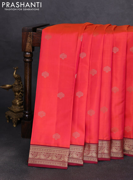 Pure kanchipuram silk saree dual shade of pinish orange and deep maroon with zari woven buttas and zari woven korvai border