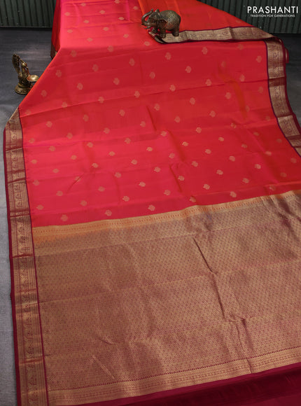 Pure kanchipuram silk saree dual shade of pinish orange and deep maroon with zari woven buttas and zari woven korvai border