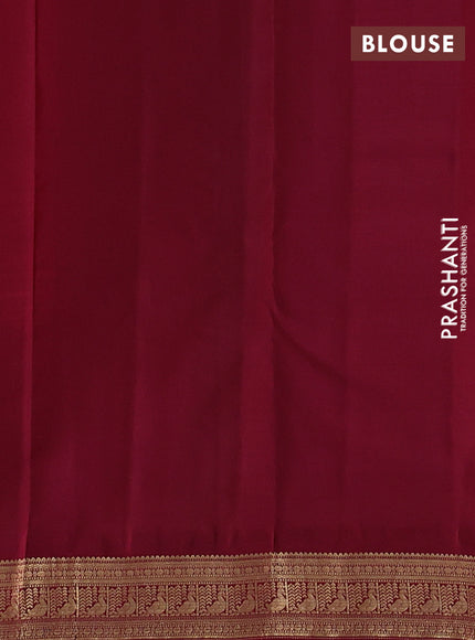 Pure kanchipuram silk saree dual shade of pinish orange and deep maroon with zari woven buttas and zari woven korvai border