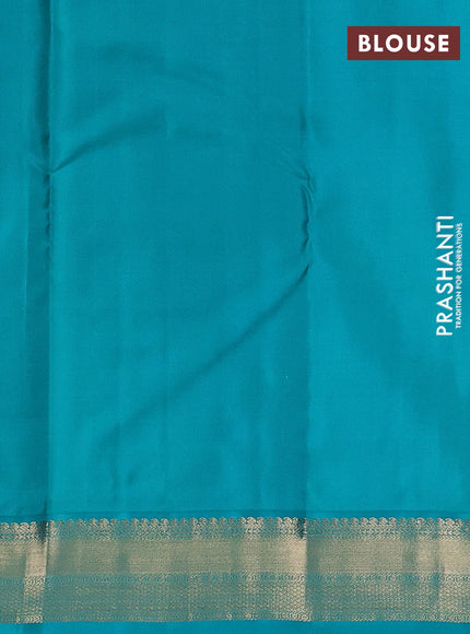 Pure kanchipuram silk saree dual shade of pinkish orange and teal blue with allover zari stripe pattern & buttas and zari woven korvai border