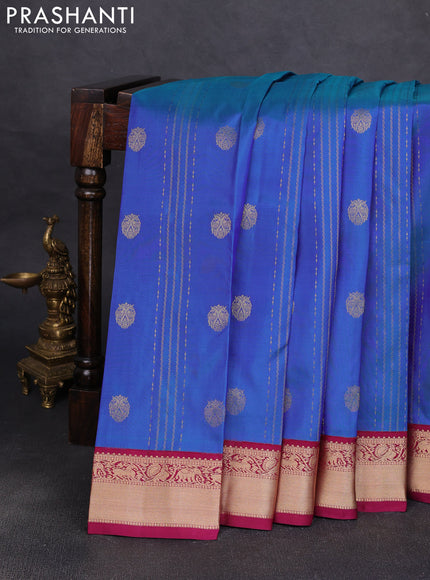 Pure kanchipuram silk saree dual shade of bluish green and wine shade with allover zari stripe pattern & buttas and zari woven korvai border