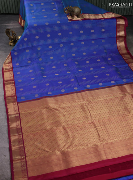 Pure kanchipuram silk saree dual shade of bluish green and wine shade with allover zari stripe pattern & buttas and zari woven korvai border
