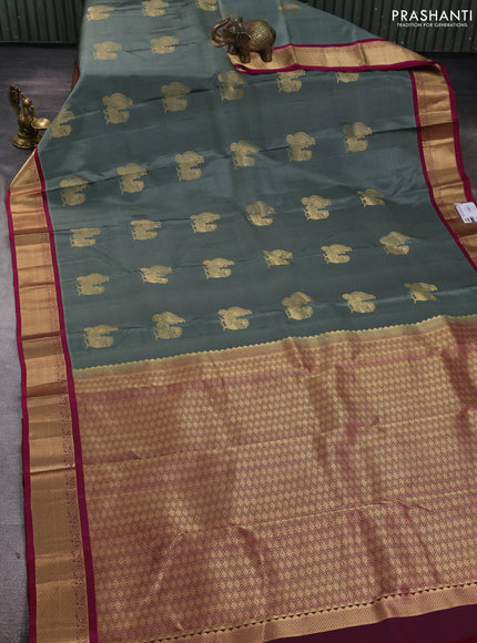 Pure kanchipuram silk saree gryish green and magenta pink with annam zari woven buttas and zari woven korvai border