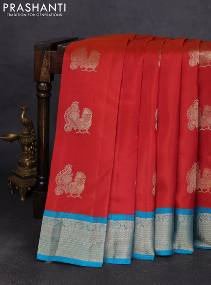 Pure kanchipuram silk saree rustic orange and cs blue with annam zari woven buttas and zari woven korvai border
