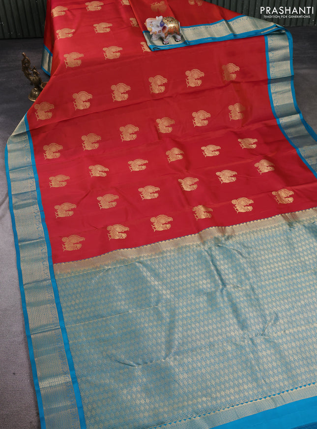 Pure kanchipuram silk saree rustic orange and cs blue with annam zari woven buttas and zari woven korvai border