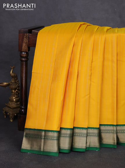 Pure kanchipuram silk saree yellow and green with allover zari stripe pattern & buttas and zari woven korvai border