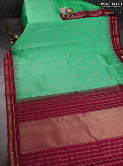 Pure kanchipuram silk saree teal green and wine shade with zari woven buttas and temple design rettapet zari woven korvai border