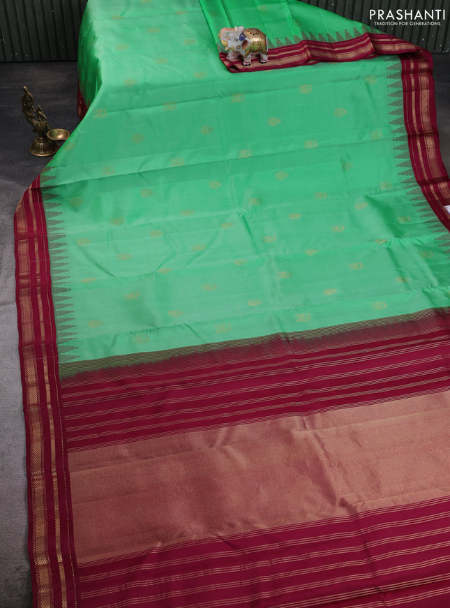 Pure kanchipuram silk saree teal green and wine shade with zari woven buttas and temple design rettapet zari woven korvai border