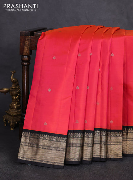 Pure kanchipuram silk saree dual shade of pinkish orange and black with zari woven buttas and zari woven korvai border