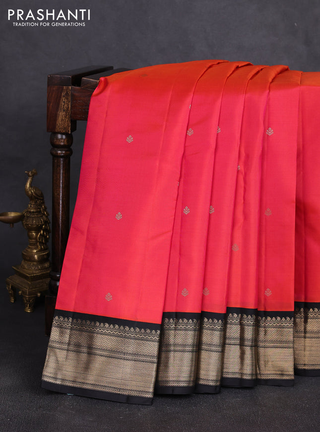 Pure kanchipuram silk saree dual shade of pinkish orange and black with zari woven buttas and zari woven korvai border