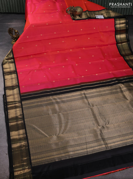 Pure kanchipuram silk saree dual shade of pinkish orange and black with zari woven buttas and zari woven korvai border