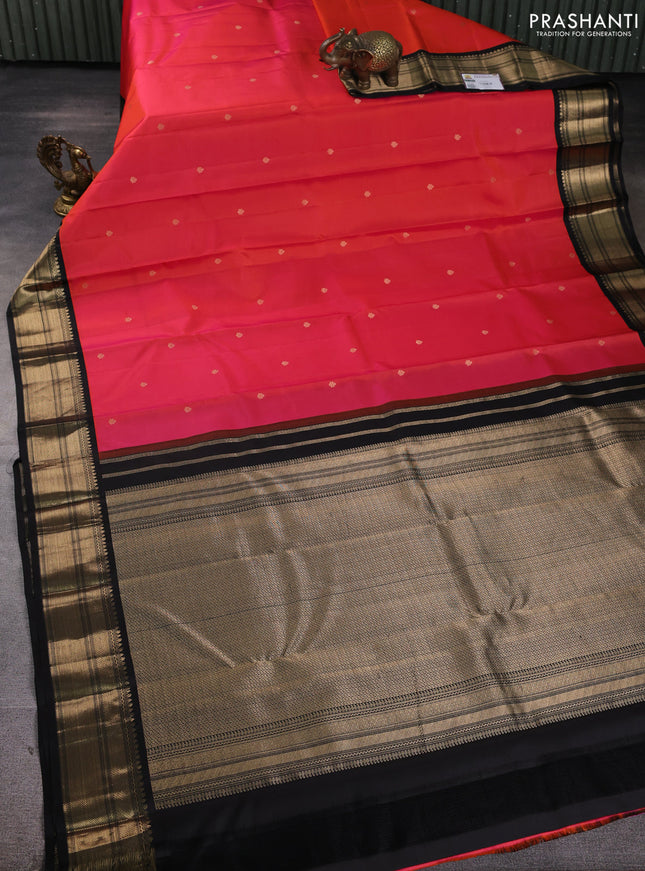 Pure kanchipuram silk saree dual shade of pinkish orange and black with zari woven buttas and zari woven korvai border