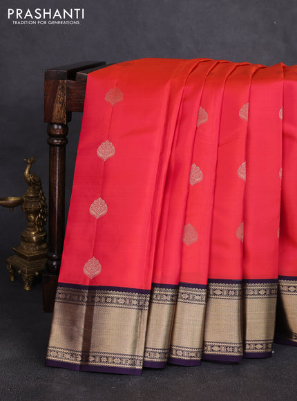 Pure kanchipuram silk saree dual shade of pinkish orange and violet with zari woven buttas and zari woven korvai border