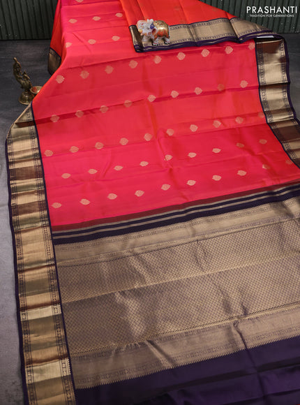 Pure kanchipuram silk saree dual shade of pinkish orange and violet with zari woven buttas and zari woven korvai border