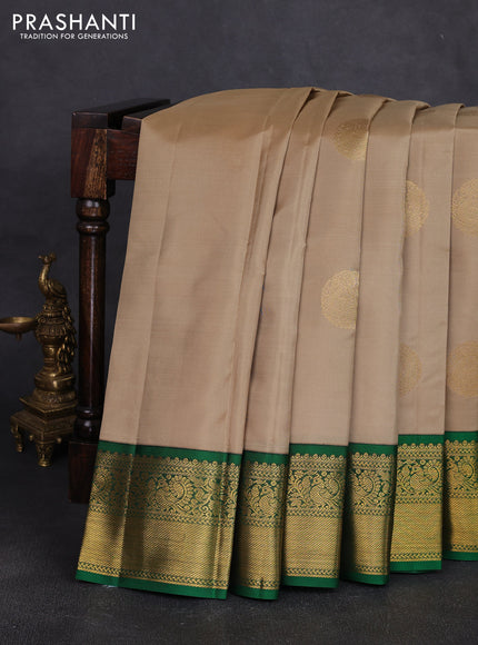 Pure kanchipuram silk saree beige and green with zari woven buttas and zari woven korvai border