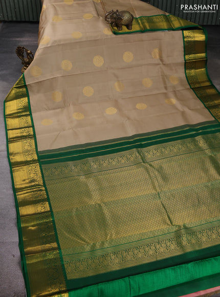 Pure kanchipuram silk saree beige and green with zari woven buttas and zari woven korvai border