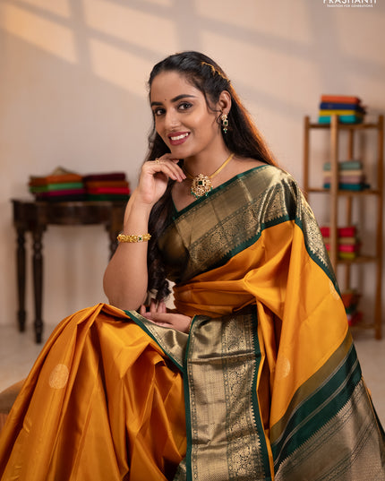 Pure kanchipuram silk saree mustard yellow and bottle green with rudraksha zari woven buttas and zari woven korvai border