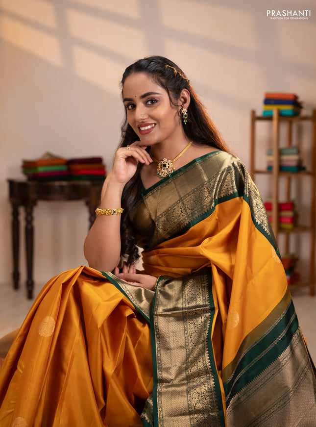 Pure kanchipuram silk saree mustard yellow and bottle green with rudraksha zari woven buttas and zari woven korvai border