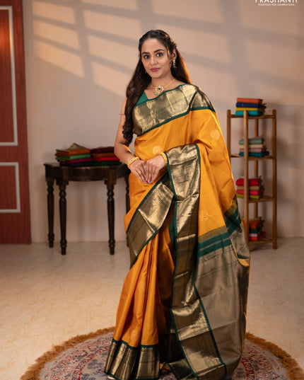 Pure kanchipuram silk saree mustard yellow and bottle green with rudraksha zari woven buttas and zari woven korvai border