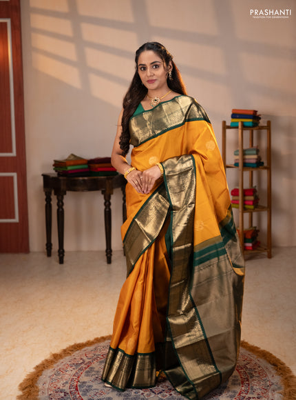 Pure kanchipuram silk saree mustard yellow and bottle green with rudraksha zari woven buttas and zari woven korvai border