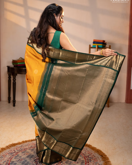 Pure kanchipuram silk saree mustard yellow and bottle green with rudraksha zari woven buttas and zari woven korvai border