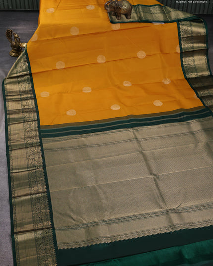 Pure kanchipuram silk saree mustard yellow and bottle green with rudraksha zari woven buttas and zari woven korvai border