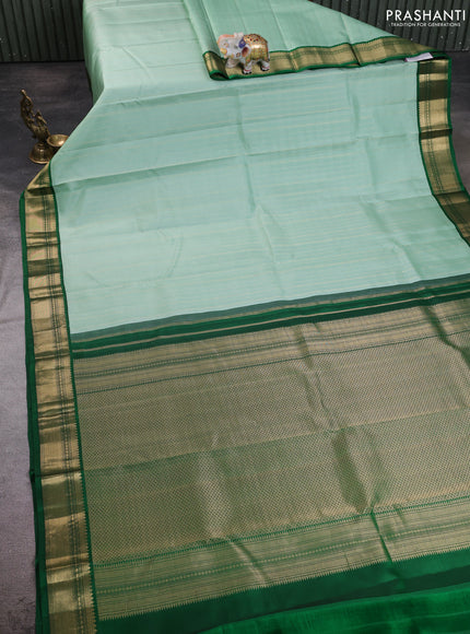 Pure kanchipuram silk saree pastel green and green with allover zari stripe pattern & buttas and zari woven korvai border
