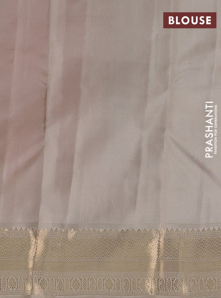 Pure kanchipuram silk saree dual shade of pinkish orange and beige with zari woven buttas and zari woven korvai border