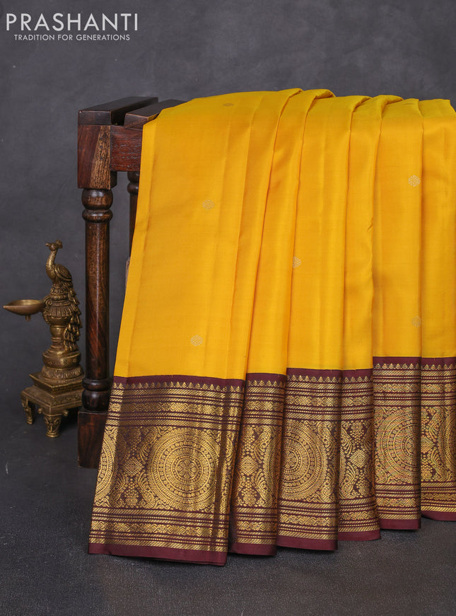 Pure kanchipuram silk saree yellow and coffee brown with zari woven buttas and long zari woven korvai border