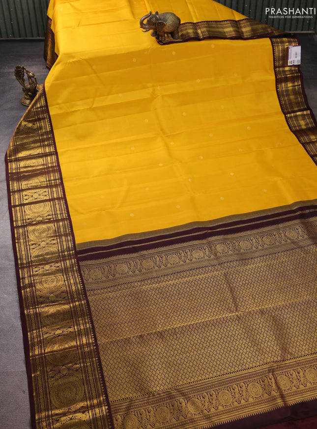 Pure kanchipuram silk saree yellow and coffee brown with zari woven buttas and long zari woven korvai border