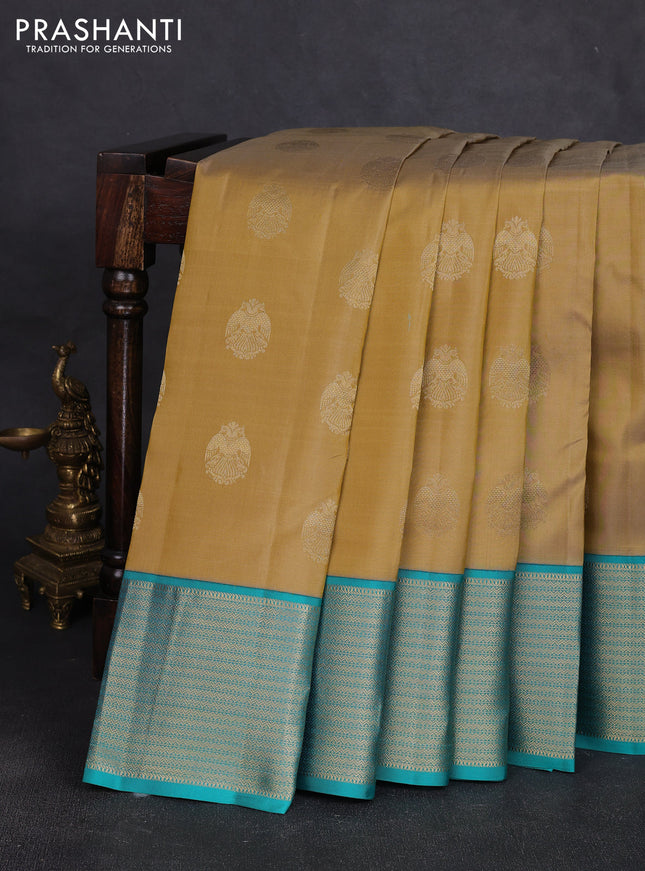 Pure kanchipuram silk saree dak beige and teal blue with allover zari woven buttas and zari woven korvai border