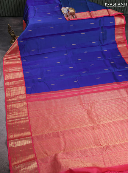 Pure kanchipuram silk saree blue and peach pink with zari woven buttas and zari woven korvai border
