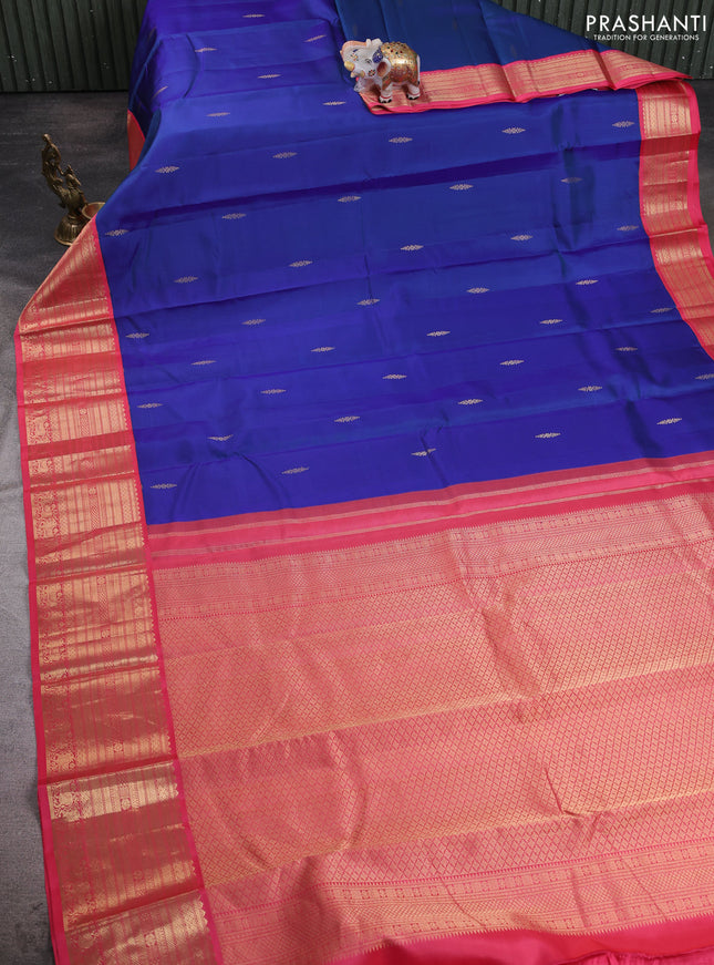 Pure kanchipuram silk saree blue and peach pink with zari woven buttas and zari woven korvai border