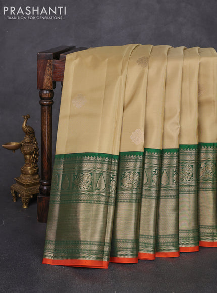 Pure kanchipuram silk saree pista green and green with zari woven buttas and long zari woven korvai border