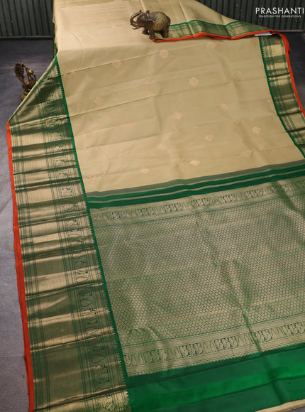 Pure kanchipuram silk saree pista green and green with zari woven buttas and long zari woven korvai border