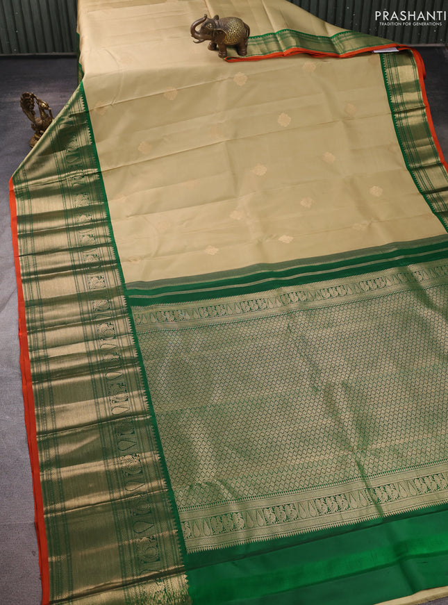 Pure kanchipuram silk saree pista green and green with zari woven buttas and long zari woven korvai border
