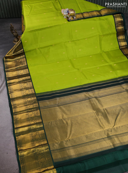Pure kanchipuram silk saree light green and bottle green with zari woven buttas and long zari woven korvai border