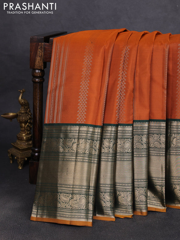 Pure kanchipuram silk saree orange and bottle green with allover zari stripe pattern and long zari woven korvai border