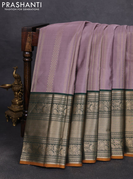 Pure kanchipuram silk saree rosy brown and bottle green with allover zari stripe pattern and long zari woven korvai border
