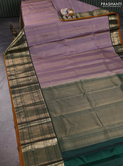 Pure kanchipuram silk saree rosy brown and bottle green with allover zari stripe pattern and long zari woven korvai border