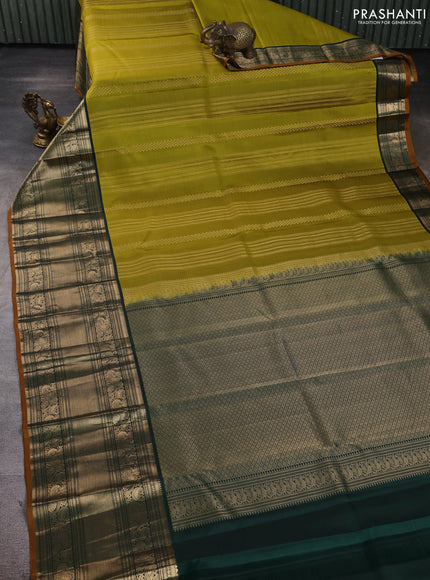 Pure kanchipuram silk saree mehendi green and bottle green with allover zari stripe pattern and long zari woven korvai border