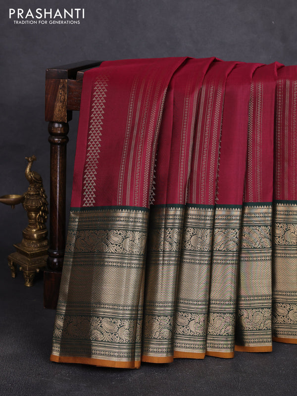 Pure kanchipuram silk saree wine shade and bottle green with allover zari stripe pattern and long zari woven korvai border