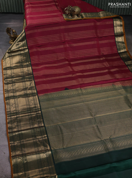 Pure kanchipuram silk saree wine shade and bottle green with allover zari stripe pattern and long zari woven korvai border