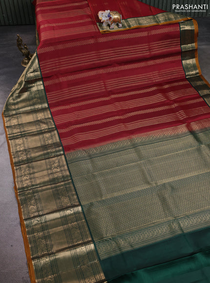 Pure kanchipuram silk saree maroon and bottle green with allover zari stripe pattern and long zari woven korvai border