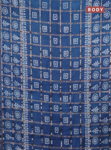 Semi chanderi saree blue shade and off white with allover zari checks & batik prints and batik printed border