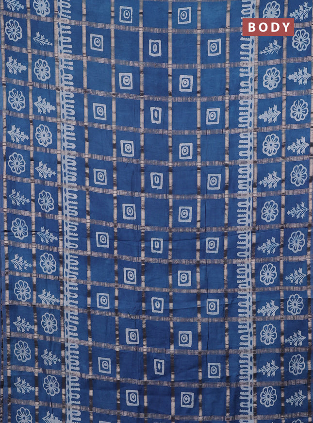 Semi chanderi saree blue shade and off white with allover zari checks & batik prints and batik printed border