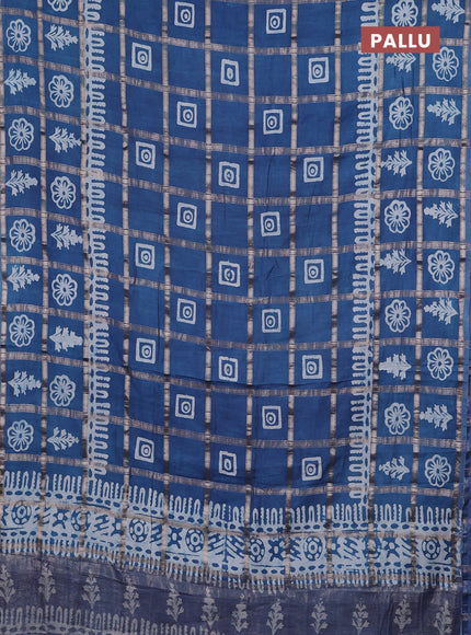 Semi chanderi saree blue shade and off white with allover zari checks & batik prints and batik printed border